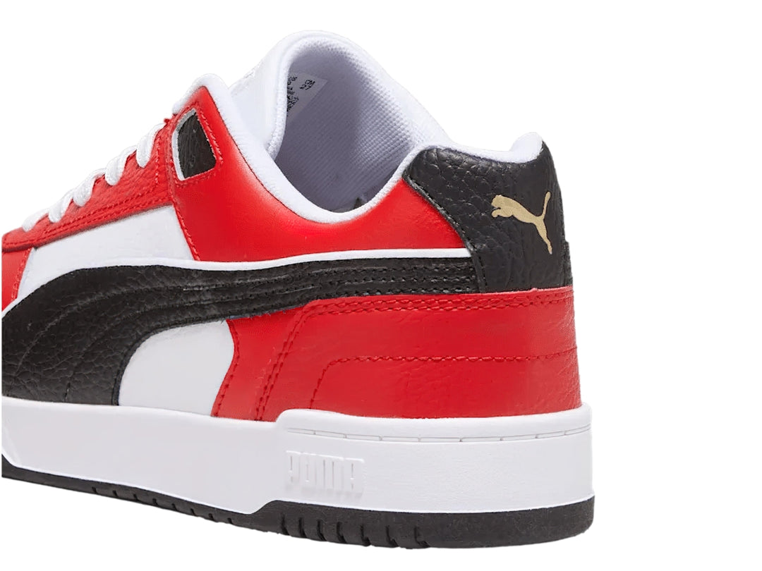 Tenis PUMA RBD Game Low en colores blanco, rojo y negro con diseño deportivo de corte bajo.