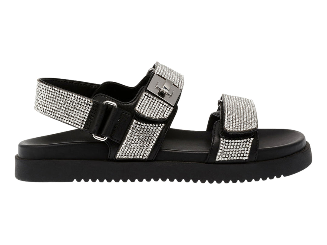 Sandalia Steve Madden color negro con correas decoradas en cristales plateados y suela de plataforma.