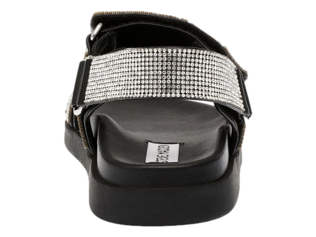 Sandalia Steve Madden color negro con correas decoradas en cristales plateados y suela de plataforma.