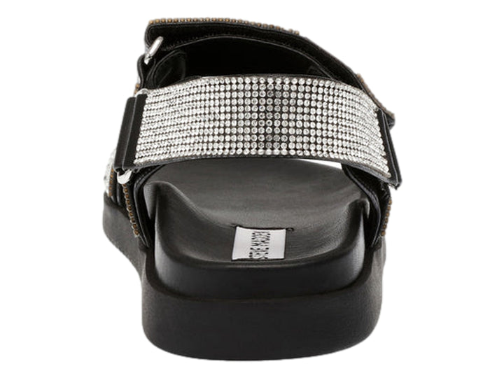 Sandalia Steve Madden color negro con correas decoradas en cristales plateados y suela de plataforma.