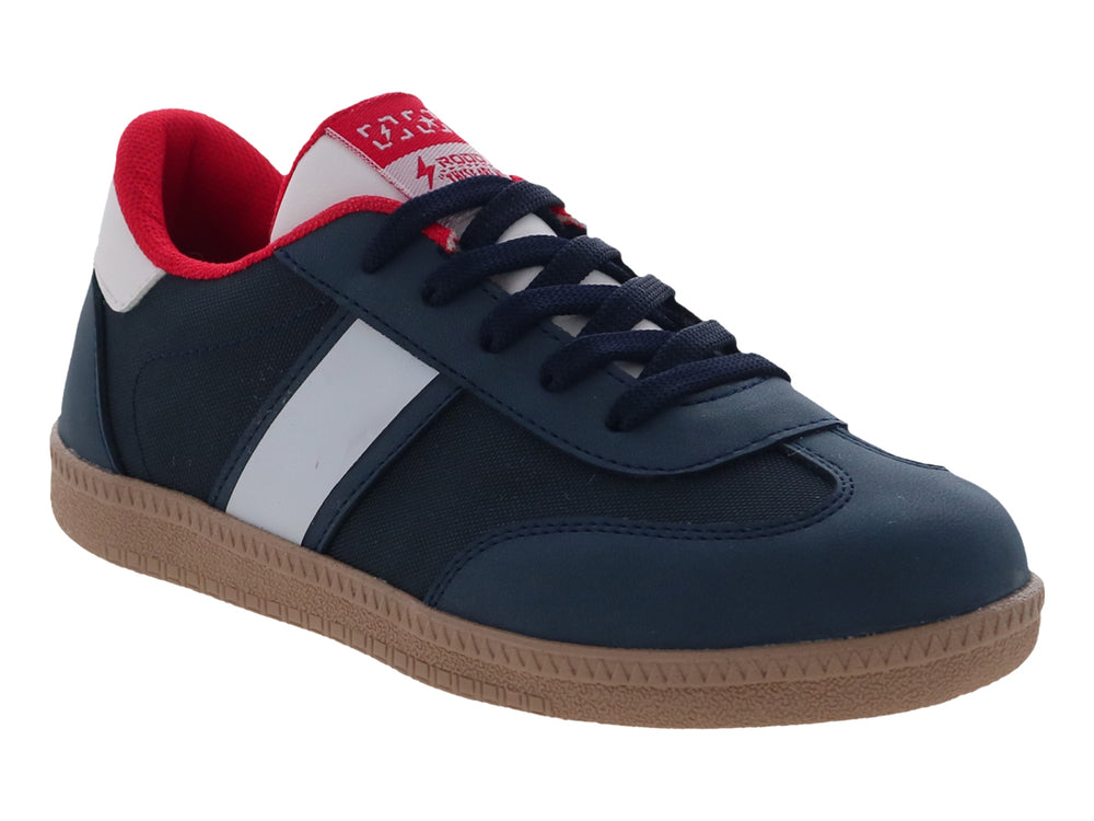 Tenis para Niño color azul marino con franja blanca lateral y suela color café.