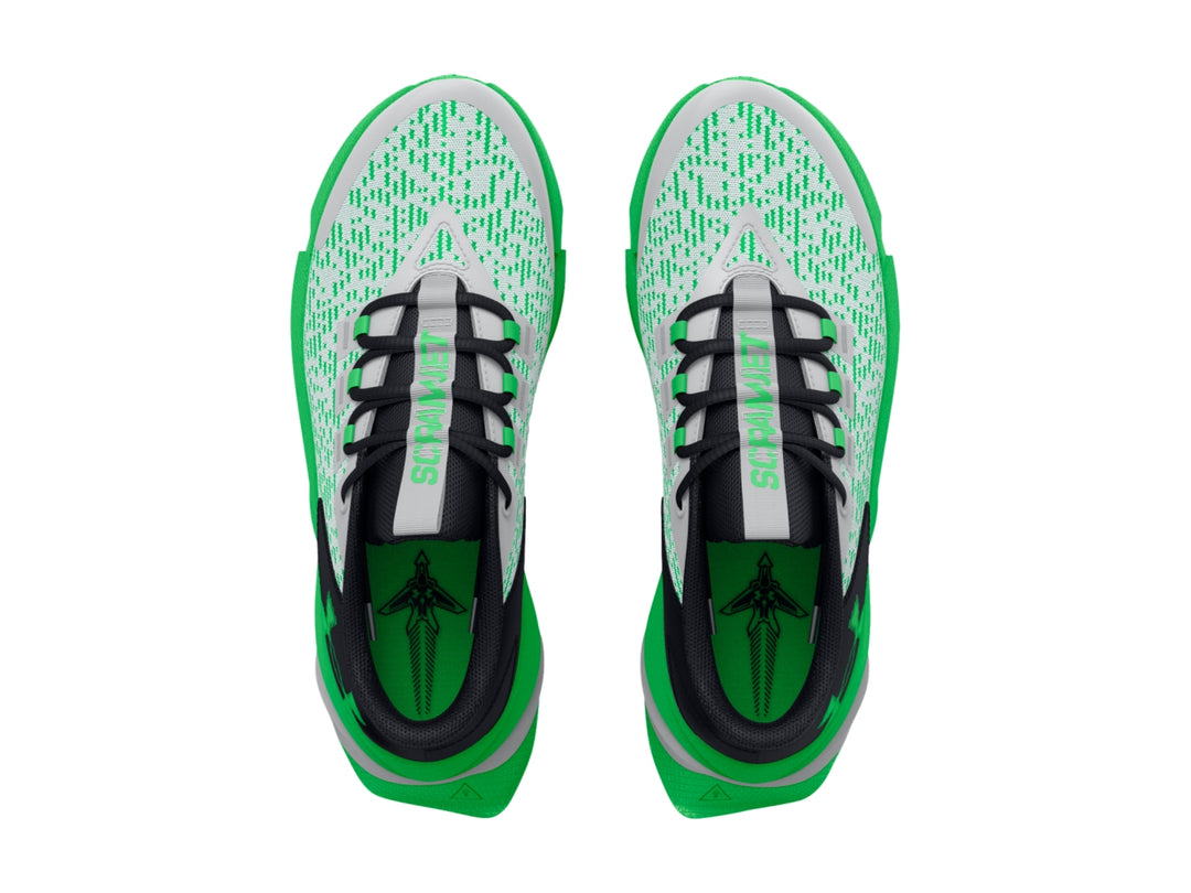 Tenis deportivos Under Armour para niños en colores gris, negro y verde brillante con suela robusta.
