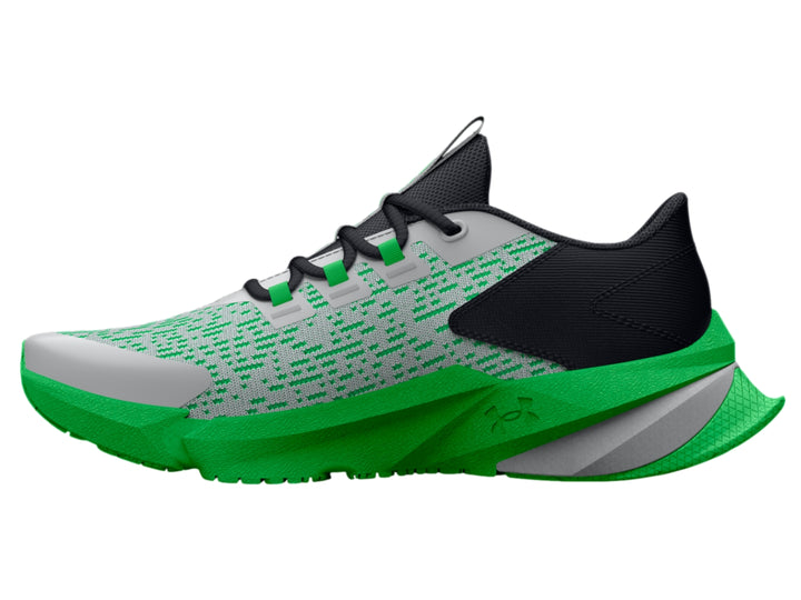 Tenis deportivos Under Armour para niños en colores gris, negro y verde brillante con suela robusta.