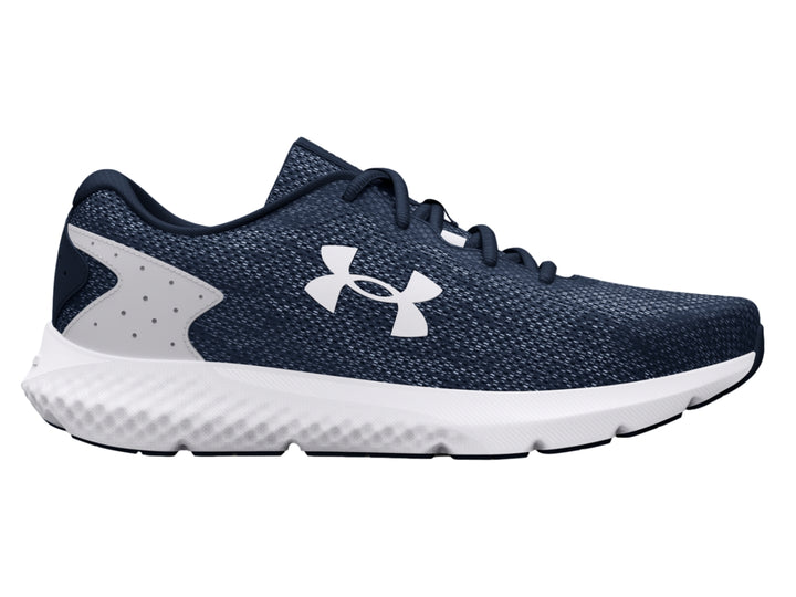 Tenis deportivos Under Armour color azul marino con suela blanca y logotipo blanco.