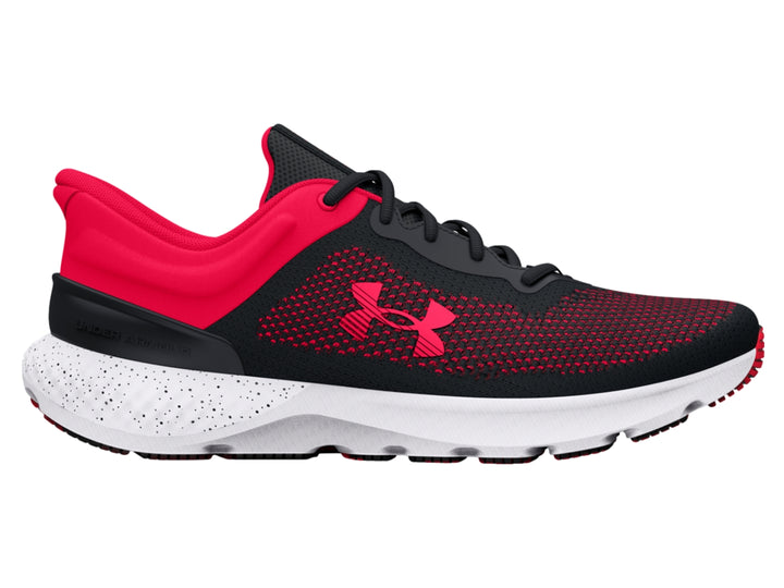 Tenis deportivos Under Armour en colores negro y rosa con suela blanca y tejido transpirable.