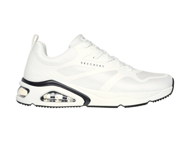 Tenis deportivos Skechers color blanco con detalles en negro y suela amortiguada con cámara de aire visible.