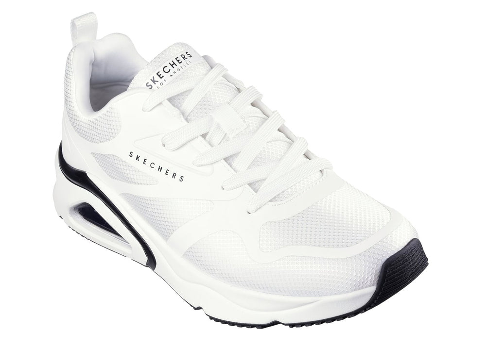 Tenis deportivos Skechers color blanco con detalles en negro y suela amortiguada con cámara de aire visible.