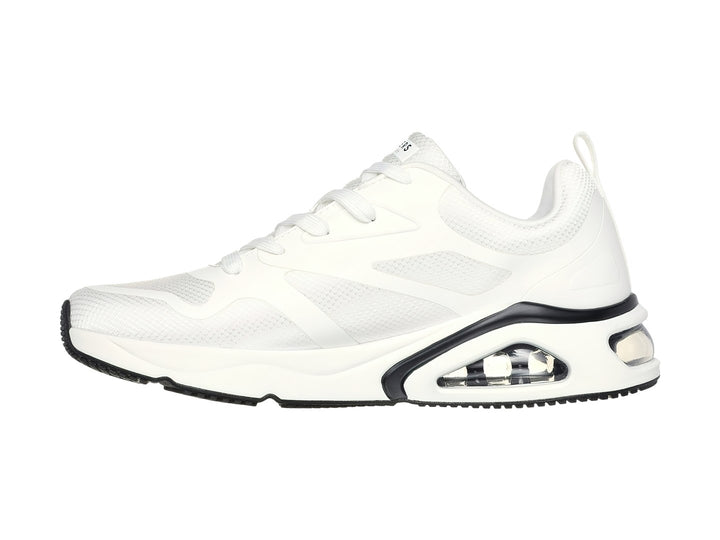 Tenis deportivos Skechers color blanco con detalles en negro y suela amortiguada con cámara de aire visible.
