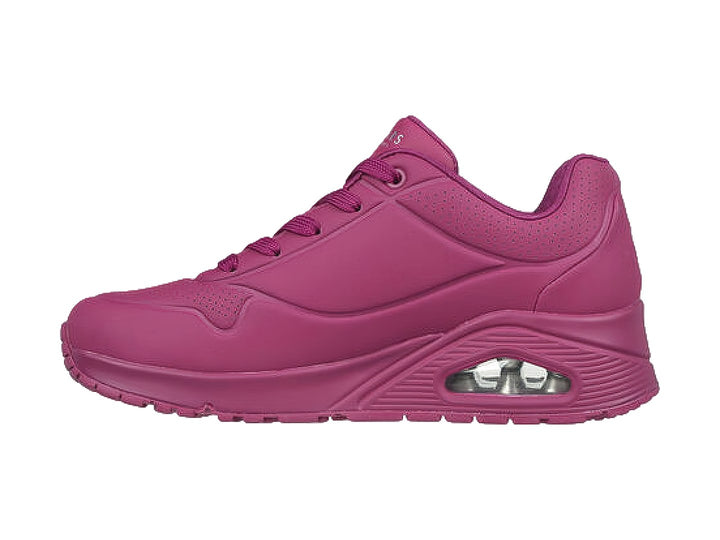 Tenis deportivos Skechers color magenta con cámara de aire visible en el talón.