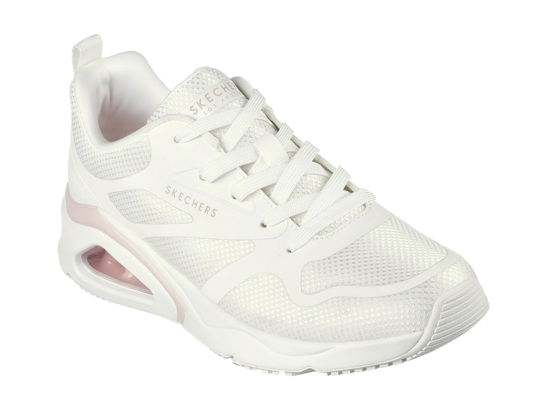 Tenis deportivos Skechers blancos con detalle rosa y cámara de aire en el talón.