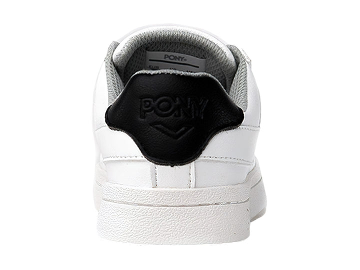 Tenis PONY blancos con detalle negro en el talón y suela blanca.