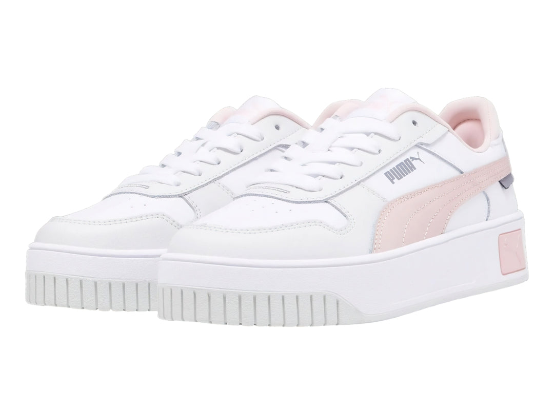 Tenis PUMA Carina Street JR en color blanco con detalles en rosa y suela de plataforma blanca.