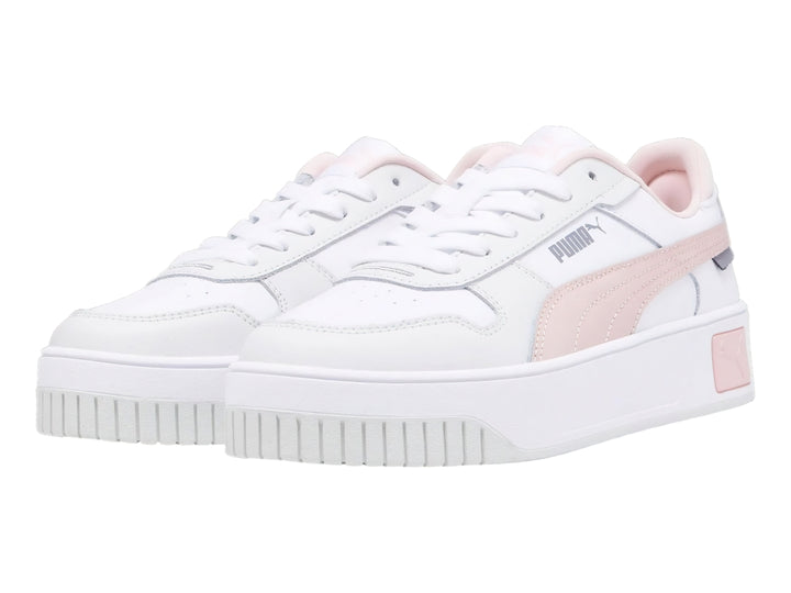 Tenis PUMA Carina Street JR en color blanco con detalles en rosa y suela de plataforma blanca.