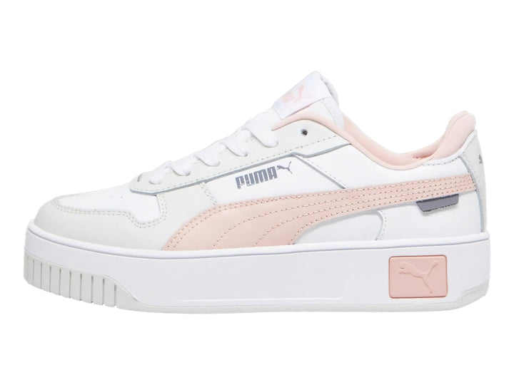 Tenis PUMA Carina Street JR en color blanco con detalles en rosa y suela de plataforma blanca.