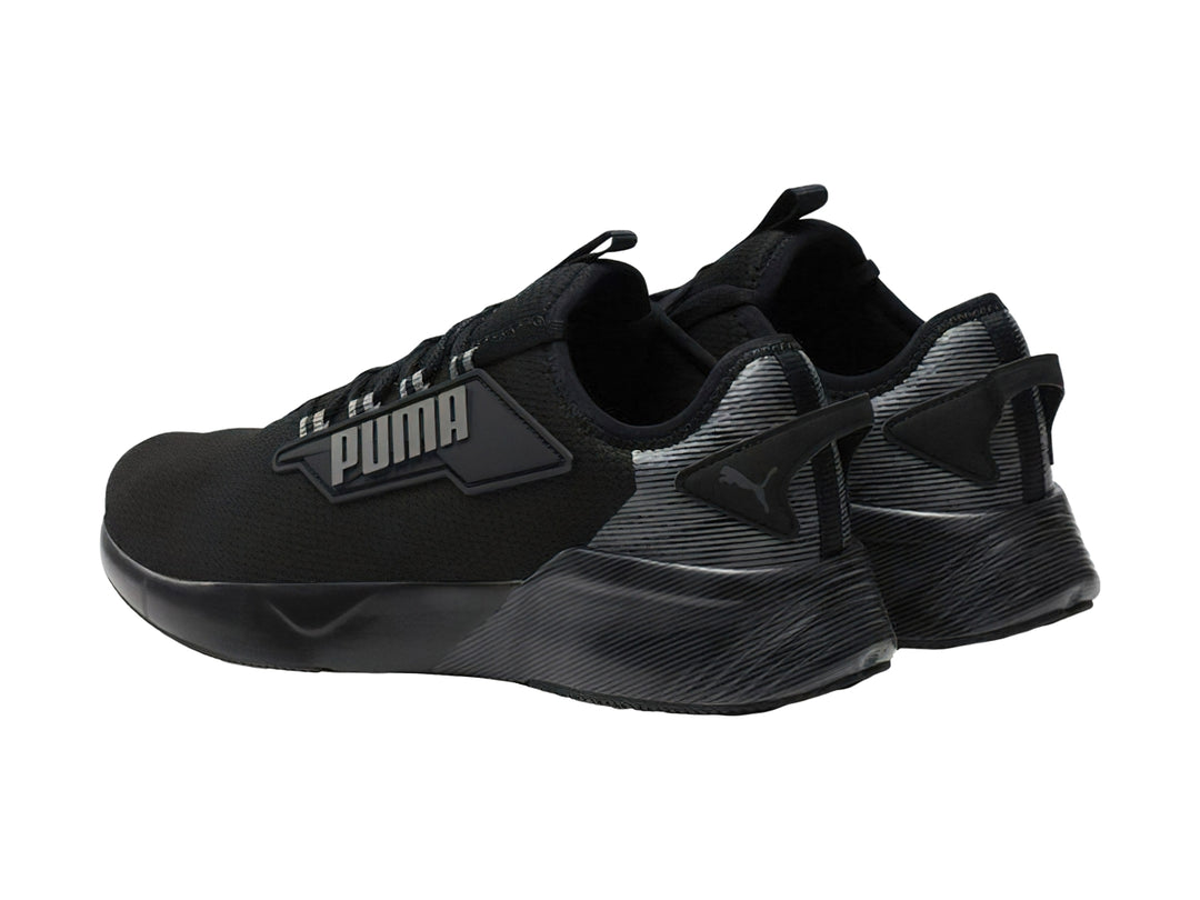 Tenis deportivos PUMA Retaliate 2 Hyperwave en color negro y gris oscuro con tejido transpirable.