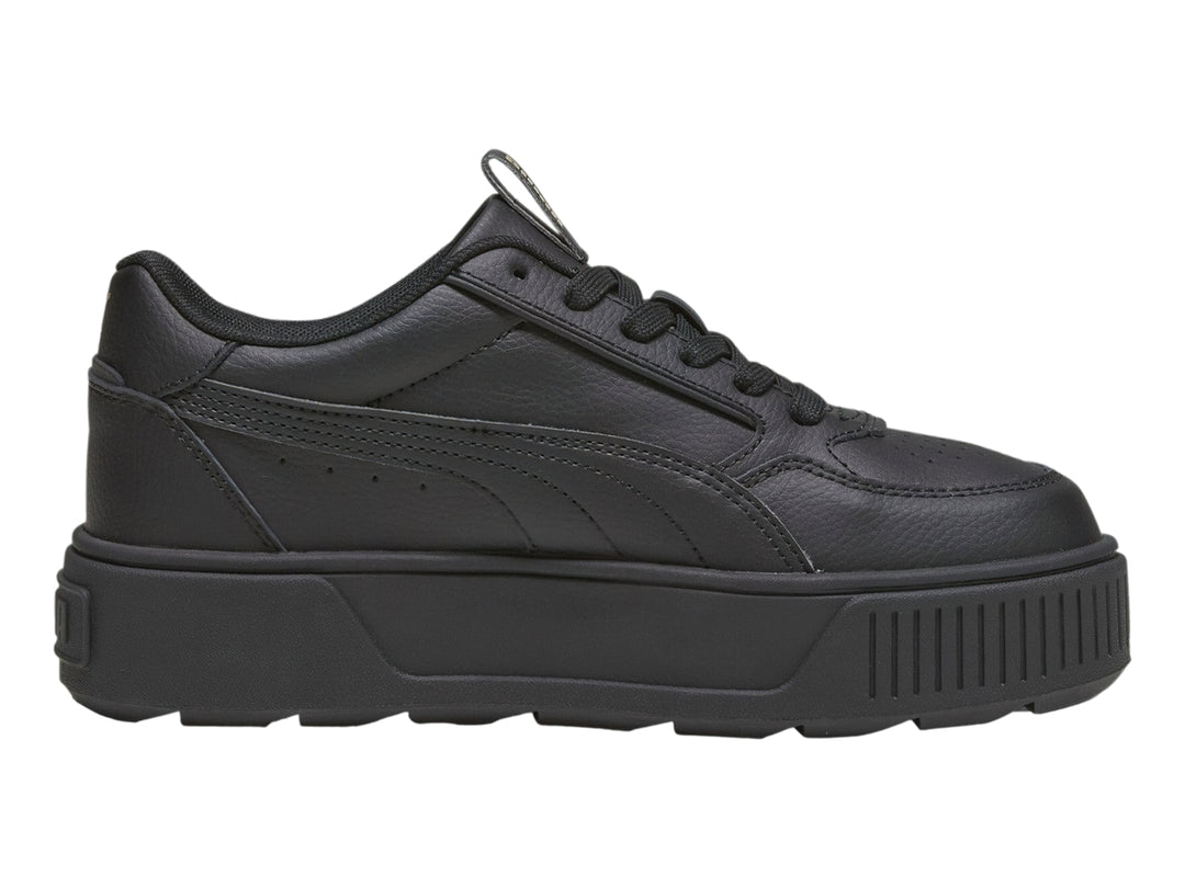 Tenis PUMA color negro con suela de plataforma gruesa y diseño deportivo.