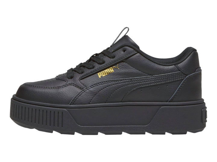 Tenis PUMA color negro con suela de plataforma gruesa y diseño deportivo.