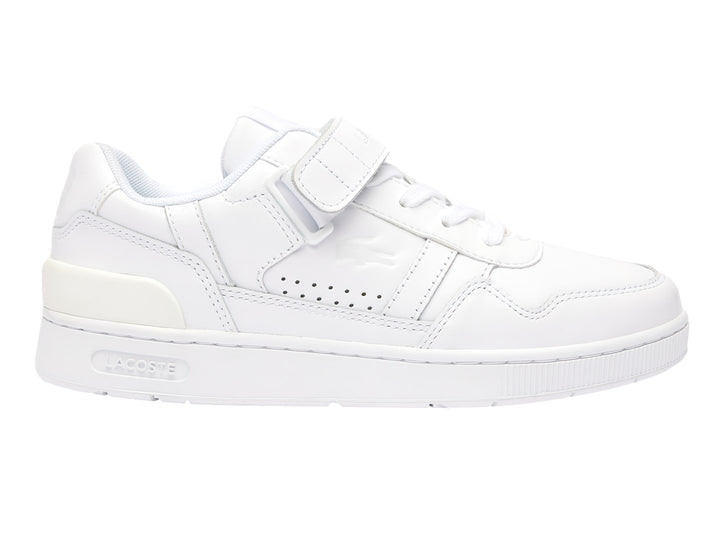 Tenis deportivos Lacoste color blanco con cierre de velcro y agujetas, diseño clásico y limpio.