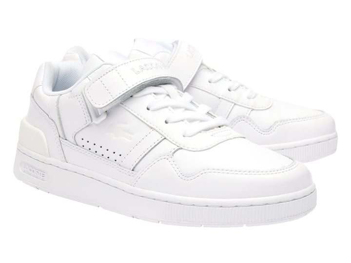 Tenis deportivos Lacoste color blanco con cierre de velcro y agujetas, diseño clásico y limpio.