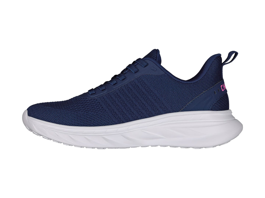 Tenis deportivos Charly en color azul marino con suela blanca y detalles en rosa.