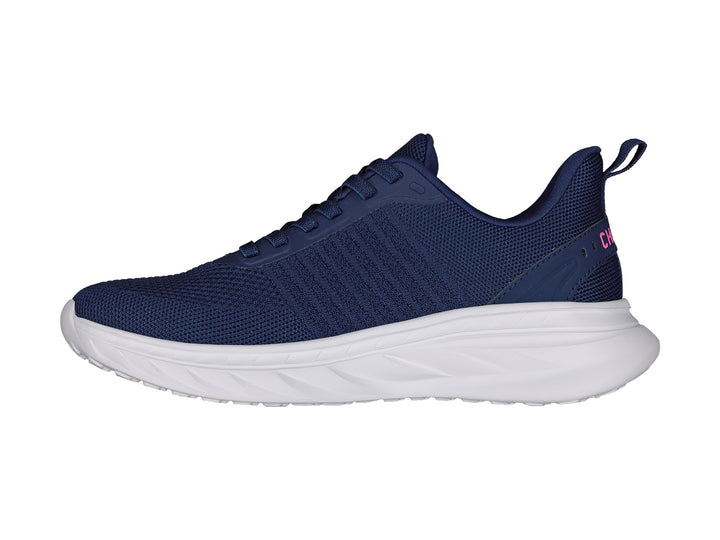 Tenis deportivos Charly en color azul marino con suela blanca y detalles en rosa.