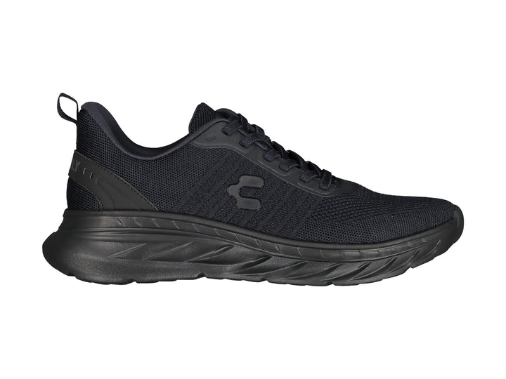 Tenis deportivos Charly color negro con tejido de malla y suela texturizada.
