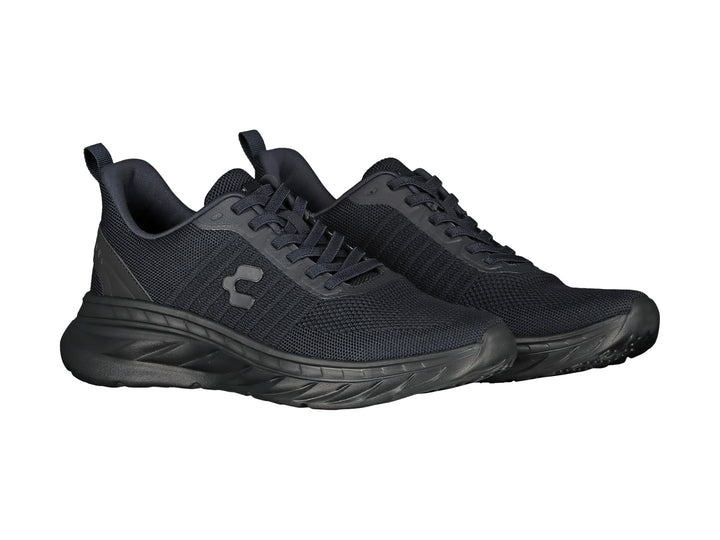 Tenis deportivos Charly color negro con tejido de malla y suela texturizada.
