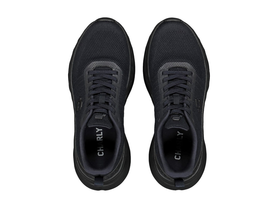 Tenis deportivos Charly color negro con tejido de malla y suela texturizada.