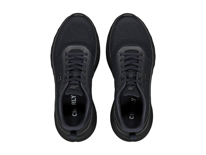 Tenis deportivos Charly color negro con tejido de malla y suela texturizada.