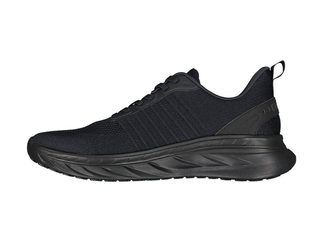 Tenis deportivos Charly color negro con tejido de malla y suela texturizada.