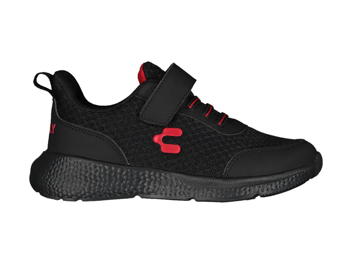 Zapato deportivo negro Charly con detalles en rojo y correa de velcro.