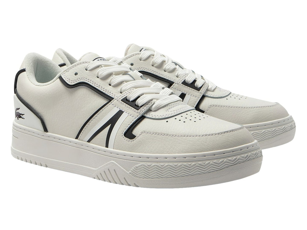 Tenis Lacoste blancos con rayas negras laterales y suela blanca.