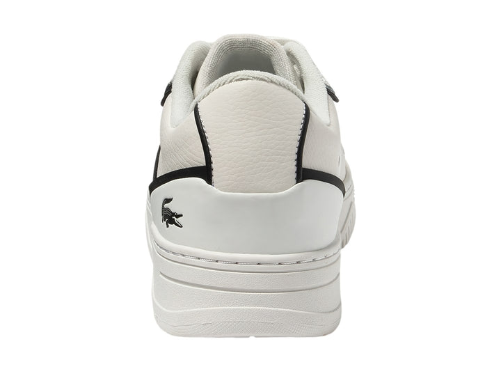 Tenis Lacoste blancos con rayas negras laterales y suela blanca.