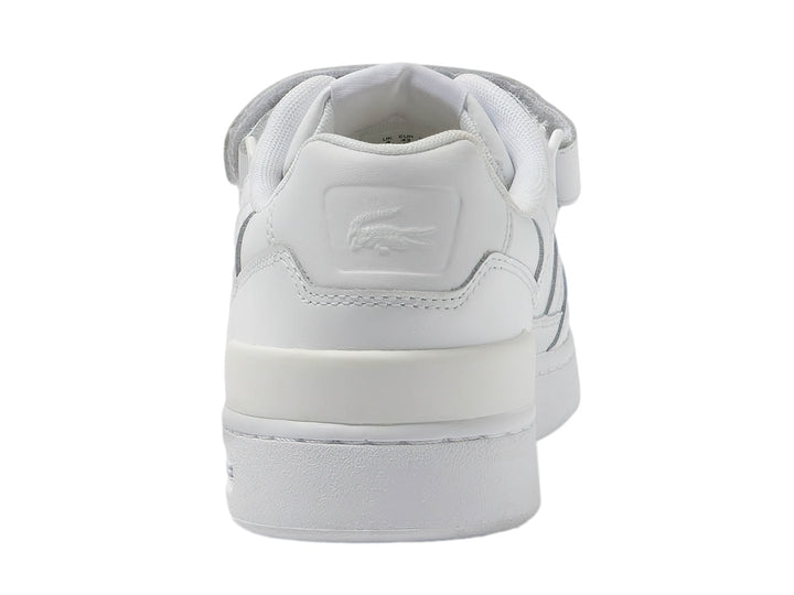 Tenis deportivos Lacoste de color blanco con cierre de velcro y suela blanca.