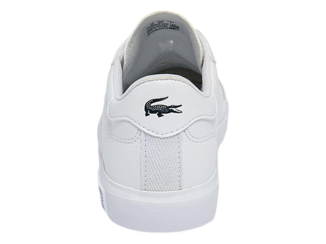 Tenis blancos Lacoste de corte bajo con logotipo del cocodrilo verde en el lateral y suela blanca.
