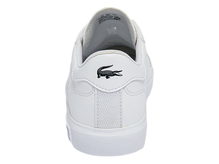 Tenis blancos Lacoste de corte bajo con logotipo del cocodrilo verde en el lateral y suela blanca.