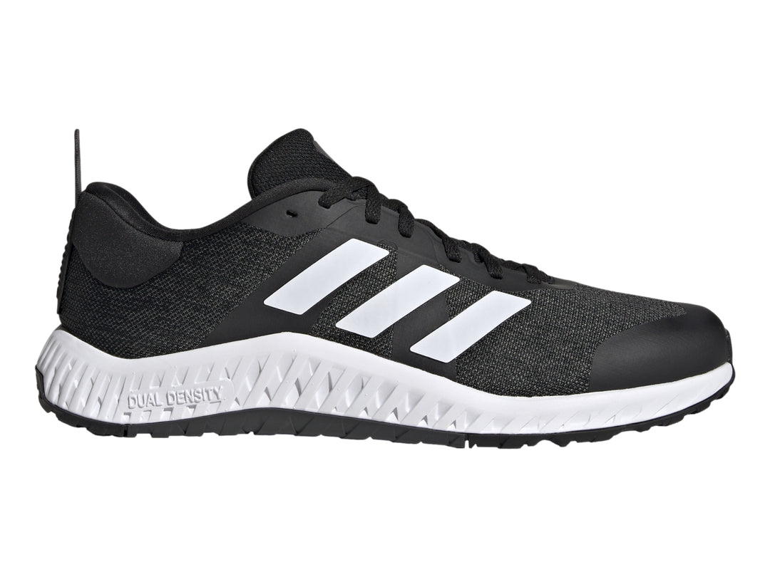 Tenis deportivos Adidas Everyset Trainer en color negro con franjas blancas y suela blanca.