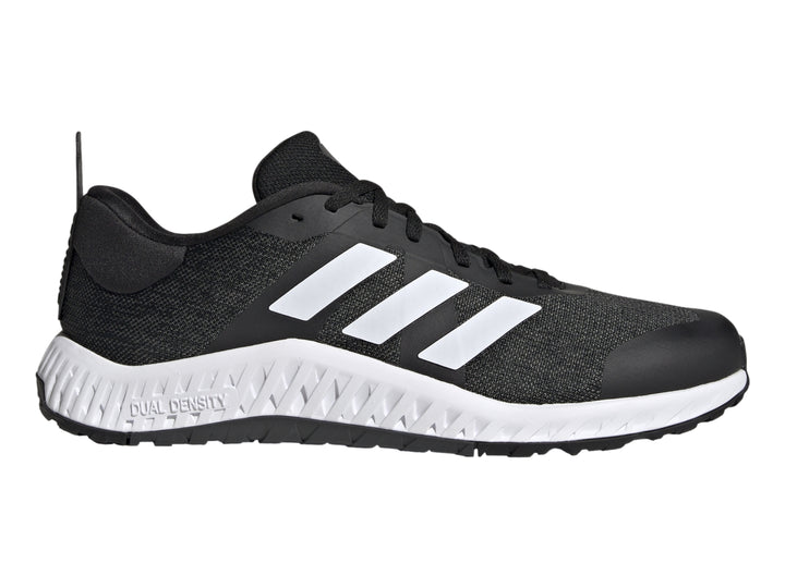 Tenis deportivos Adidas Everyset Trainer en color negro con franjas blancas y suela blanca.