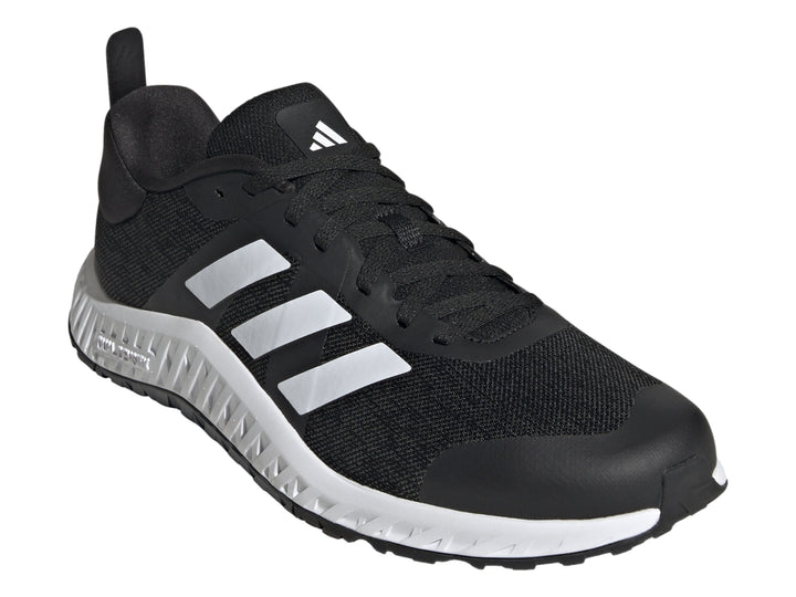 Tenis deportivos Adidas Everyset Trainer en color negro con franjas blancas y suela blanca.