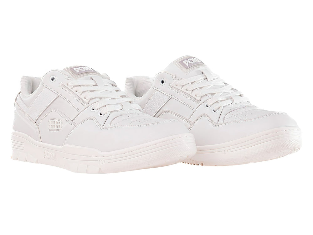 Tenis PONY M-100 LO en color blanco, diseño deportivo de corte bajo con suela blanca.