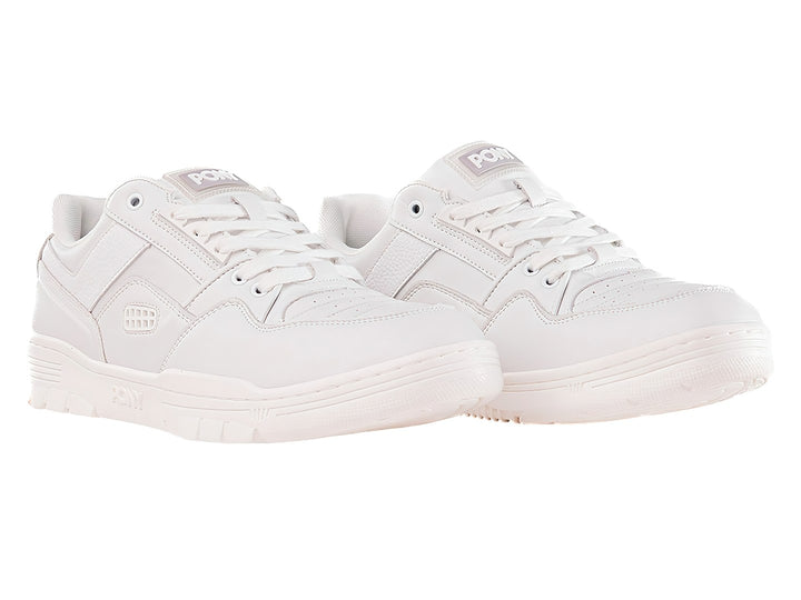 Tenis PONY M-100 LO en color blanco, diseño deportivo de corte bajo con suela blanca.
