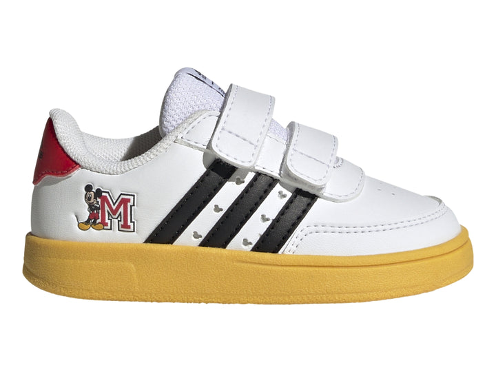 Tenis blancos Adidas para niño con suela amarilla, franjas negras y diseño de Mickey Mouse con cierres de velcro.
