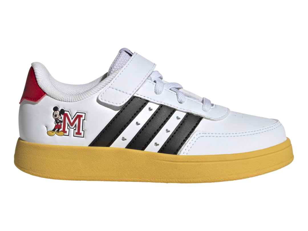 Tenis Adidas blancos con suela amarilla, franjas negras y gráfico de Mickey Mouse.