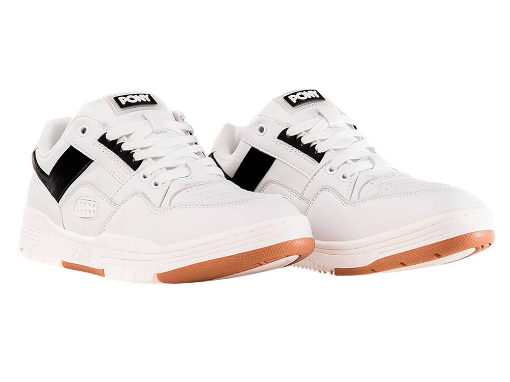 Tenis PONY blancos con franja negra lateral y suela color miel.