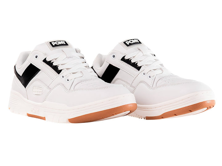 Tenis PONY blancos con franja negra lateral y suela color miel.