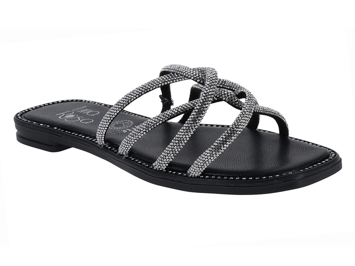 Sandalia plana color negro con tiras brillantes plateadas entrelazadas para mujer.
