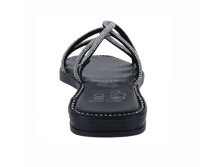 Sandalia plana color negro con tiras brillantes plateadas entrelazadas para mujer.