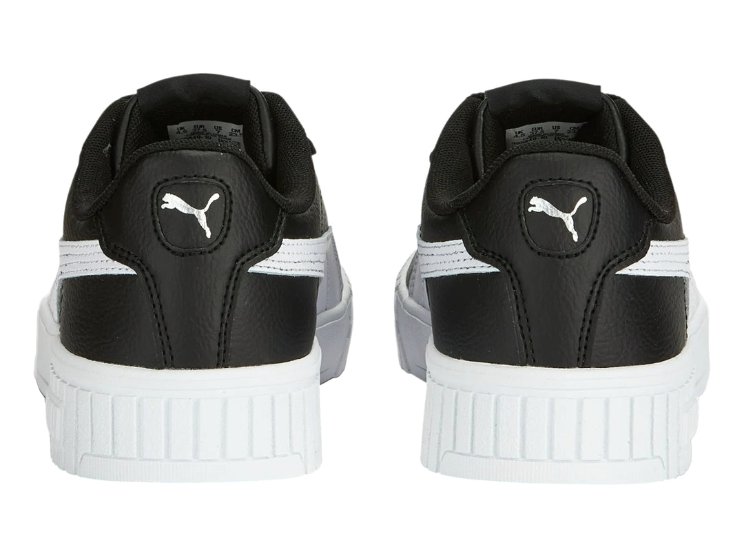 Tenis PUMA Carina 2.0 color negro con suela blanca y franja lateral blanca.