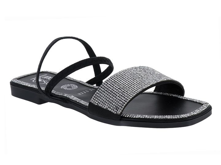 Sandalia plana color negro con tiras y detalles brillantes en oro rosado para niña.