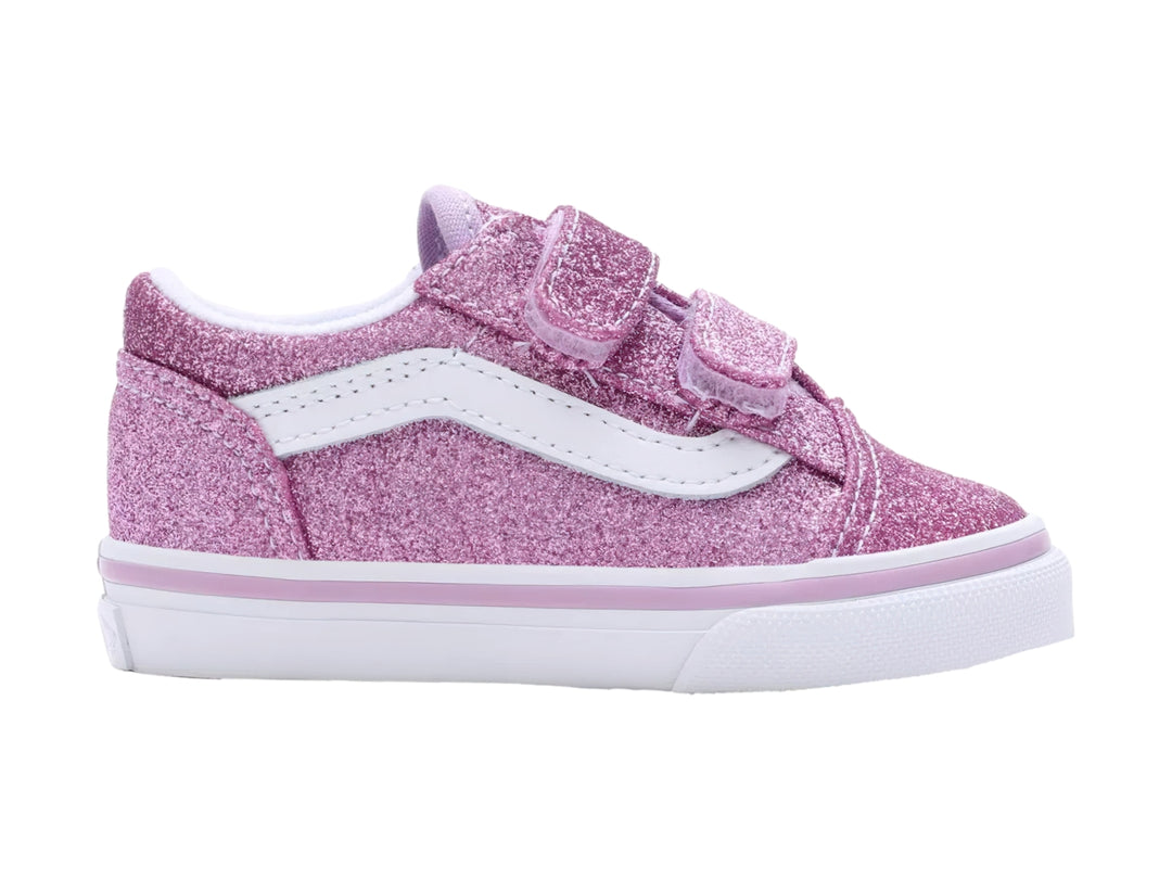 Tenis VANS Old Skool color morado brillante con suela blanca y cierres de velcro.
